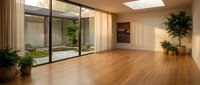Modern minimalist interior with large glass windows overlooking courtyard garden, wooden floors and natural lighting for contemporary home design.