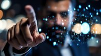 Businessman touching virtual interface with digital data visualization and binary code, demonstrating future technology and innovation in corporate setting.