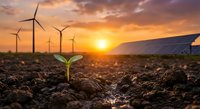 Green plant seedling growing in soil with wind turbines and solar panels at sunset representing renewable energy and sustainable development for eco-friendly projects.