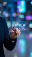 Businessman touching contact us button on virtual screen with communication icons in blurred city background for customer service and support.