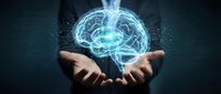Businessman hands holding glowing digital brain hologram with neural networks and data connections for artificial intelligence and technology concepts.