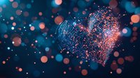 Glowing heart shape formed by luminous particles with blue and coral sparkles against dark background with bokeh lights for romantic designs and valentines.