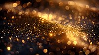 Abstract golden bokeh lights and glitter particles on dark background with blurred sparkles and magical glowing effect, festive holiday atmosphere.