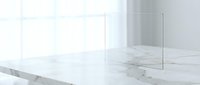 Modern minimalist white marble kitchen countertop with glass panels in bright contemporary interior for home design and renovation projects.