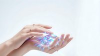 Female hands holding glowing holographic digital cube with blue and purple light effects on white background, representing technology, innovation, and future digital solutions.
