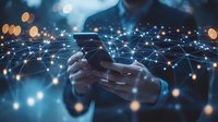 Person using smartphone with glowing network connections overlay in dark blue atmosphere with bokeh lights, representing digital connectivity and mobile technology.