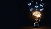 Light bulb with glowing brain filament and floating technology icons representing innovation, creativity, artificial intelligence and digital transformation.