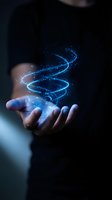 Hand holding glowing blue digital spiral with sparkling particles floating above palm against dark background for technology and innovation concepts.