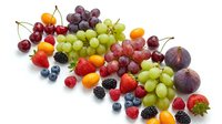 Fresh mixed fruits and berries collection isolated on white background for healthy eating and nutrition concepts.
