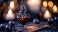 Ornate metal lantern with intricate patterns casting warm light on open book, creating atmospheric reading scene with bokeh background for cozy interior design.