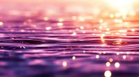 Magical purple water surface with golden bokeh lights and ripples creating dreamy atmosphere. Macro photography of liquid texture with sunset reflections.