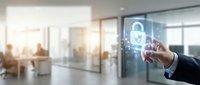 Businessman touching digital security lock icon in modern office environment representing cybersecurity and data protection technology solutions.
