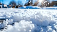 Fresh snow crystals glisten in bright sunlight creating magical winter atmosphere with natural bokeh effect and blurred background, macro close-up view.