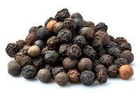 Pile of whole black peppercorns, mixed varieties including Tellicherry and Malabar, for culinary use in cooking, seasoning, and spice blends.