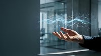 Businessman hand holding glowing digital wave graph representing financial data analysis, market trends, and business growth in modern corporate office environment.