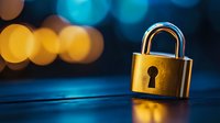 Golden padlock on dark surface with blurred bokeh lights in blue and yellow tones creating atmospheric background for security and protection concepts.