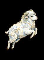 Leaping ram with ornate floral and swirl details in soft blue and gold tones, isolated on transparent background, ready for stickers, sublimation, and print on demand.