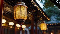 Traditional Asian lantern glowing with warm light against blurred temple architecture background, creating atmospheric evening ambiance with multiple illuminated lamps.
