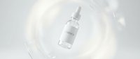 Transparent serum bottle with dropper suspended in swirling liquid splash, isolated on white background for skincare product packaging and cosmetic design use.