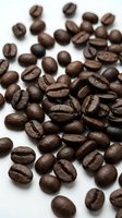 Roasted coffee beans scattered on white background, isolated and ready for beverage, cafe, and food industry design projects.