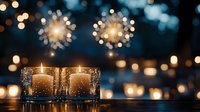 Glowing candles in glass holders against blurred bokeh lights background create romantic atmosphere for holiday celebrations and special events.