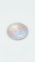 Isolated glass coin with plant and euro symbol divided design on white background, suitable for financial, sustainability, and eco-business graphics.