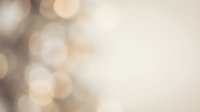 Soft bokeh background with warm beige and cream tones, blurred light circles creating an elegant, dreamy atmosphere suitable for overlays, presentations, and design projects.