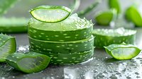 Fresh aloe vera slices with water drops on dark background, natural organic skincare ingredient for beauty and wellness products, spa concept macro shot.