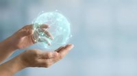 Hand holding glowing digital globe representing global connectivity, technology innovation, and worldwide business communication networks for corporate solutions.
