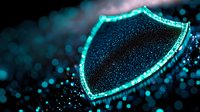 Glowing shield symbol with neon turquoise light effect on dark background with bokeh particles, representing digital security and cyber protection concept.