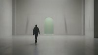 Man in dark clothing standing in minimalist concrete interior space with glowing green arched doorway, symbolizing opportunity, transition, and future possibilities for corporate and conceptual design projects.