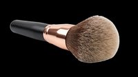 Makeup brush with black handle and rose gold ferrule featuring soft natural bristles, isolated on transparent background for design use, clipart, sublimation, and print-on-demand products.