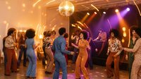 Retro disco party with diverse group dancing under colorful lights and mirror ball in 1970s nightclub setting with vintage fashion and groovy atmosphere.