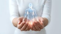 Doctor or healthcare professional holding glowing digital human body hologram in hands, representing medical technology, health monitoring, and digital wellness innovation.