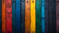Vibrant multicolored wooden planks with rustic texture create vertical stripes pattern. Weathered boards in rainbow hues showcase natural grain and vintage character.