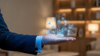 Professional businessman in suit presenting holographic financial data analytics icons floating above open palm in modern office environment for business presentations.