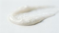 Creamy white cosmetic product sample isolated on light background, suitable for skincare, lotion, moisturizer, or beauty product packaging and marketing materials.