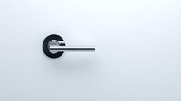 Minimalist modern door handle in black and chrome finish against white wall, showcasing contemporary interior design elements and clean architectural detail.