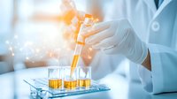 Medical researcher in white coat and gloves conducting laboratory experiment with yellow liquid samples in test tubes, glowing orange light effect for science background.