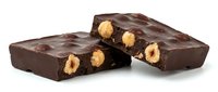 Dark chocolate confection with roasted peanuts, isolated on white background. Suitable for food packaging, recipe blogs, bakery marketing, and culinary publications.