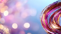 Swirling metallic pink and gold abstract curves with glitter against dreamy bokeh background in purple and blue tones, creating magical festive mood.