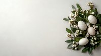 Easter wreath with white eggs and spring flowers on green leaves against neutral background. Perfect for holiday designs.