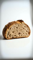 Sliced artisan bread with golden crust and airy crumb structure on white background, suitable for bakery, food, and culinary marketing.