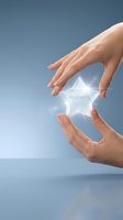 Hands of a Caucasian woman framing a glowing star symbol with readiness text against blue background for business concepts.