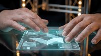 Hands of a middle-aged Caucasian male professional interacting with a holographic digital interface display, showcasing futuristic technology and innovation for business applications.
