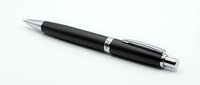 Elegant black ballpoint pen with silver chrome accents and clip isolated on white background for business stationery and office supplies design.