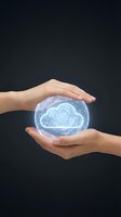Hands protecting glowing cloud computing hologram with digital network connections on dark background for technology and data security concepts.