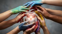 Multiple hands painted in vibrant rainbow colors united around glowing heart symbol, representing diversity, unity, teamwork, and collective compassion for social causes and community support.