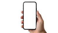 Hand holding modern smartphone with blank white screen isolated on white background for mobile app presentation and digital mockup design.