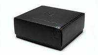 Black cardboard shipping box isolated on white background for packaging and delivery services.